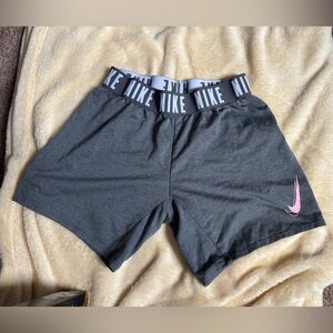 Nike Women's DRI-FIT Athletic Shorts in Dark Gray with Pink Swoosh